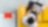 man sitting on a yellow sofa with laptop on his lap